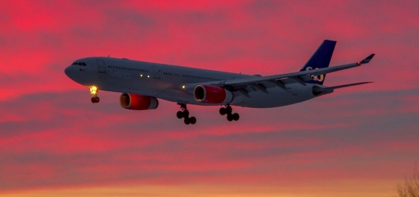 Aeroplane flying at dawn time